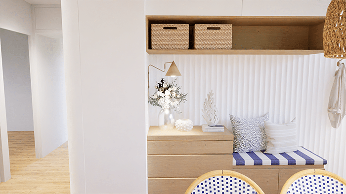 Aménagement d’entrée dans une maison à Cholet par ABL Intérieur avec une banquette sur-mesure en bois clair et assise en tissus rayé bleu et blanc. Meuble 3 tiroir et niche en bois clair. Panneaux décoratif orac blanc. Applique en laiton. Style transitionnel mixé avec un style bord de mer.